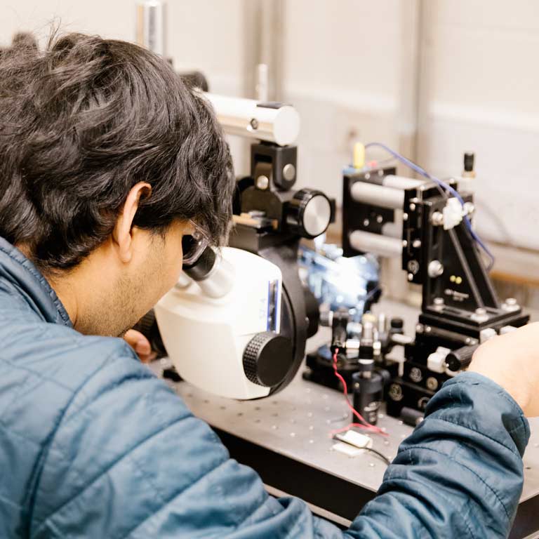 A man using special goggles in the laboratory.